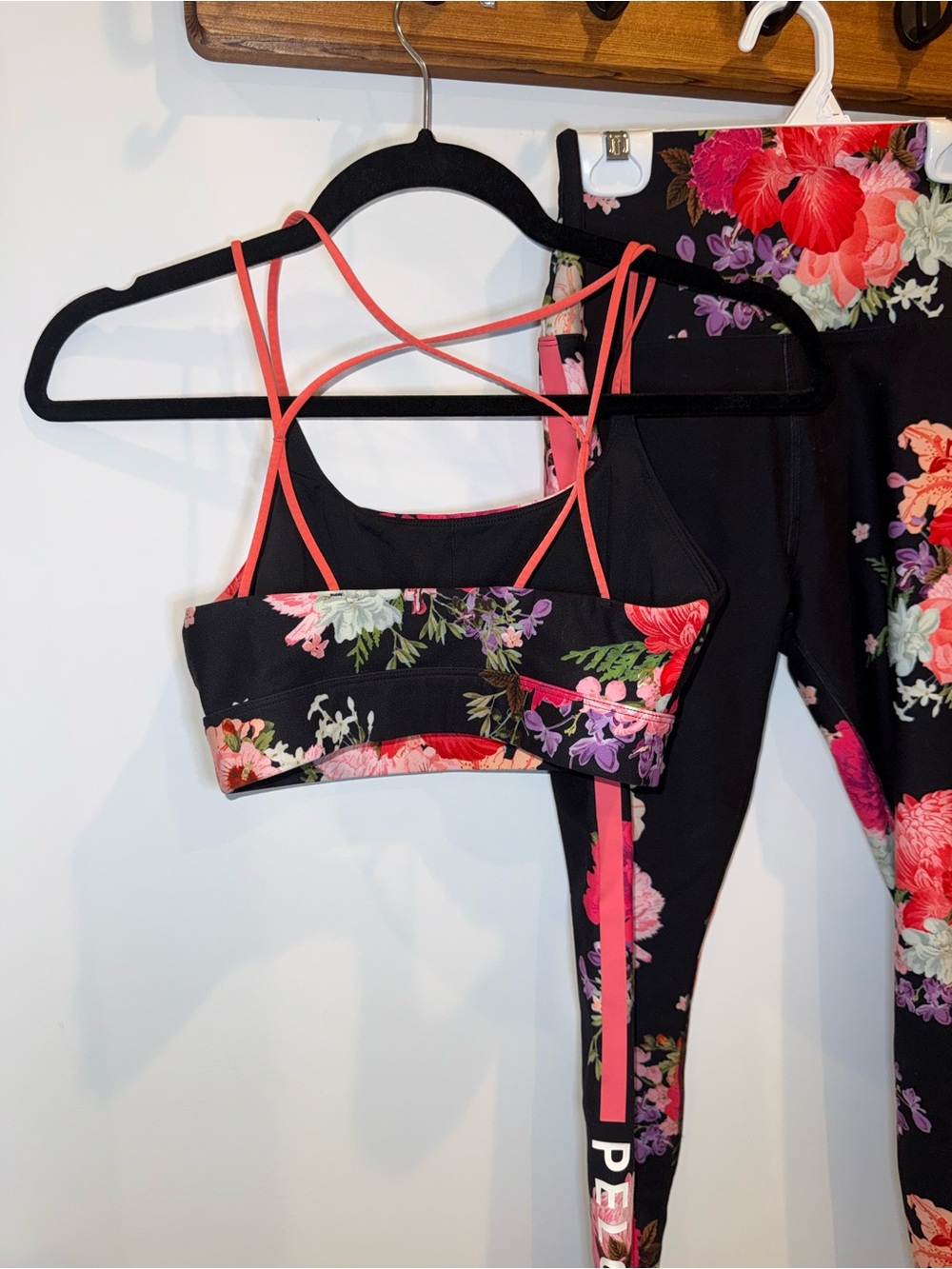 Peloton Black Leggings and Floral Sports Bra Set with Pink Accents - Picture 2 of 5